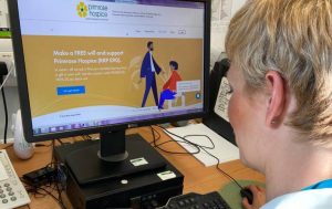 Helen Watson from Primrose Hospice looking at the Guardian Angel Will writing website for Make A Will Month 2020