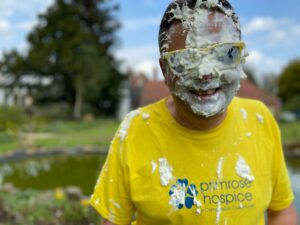 Primrose Hospice CEO David Burrell with the remenants of custard pie on his face