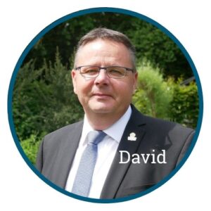 David Burrell, CEO of Primrose Hospice stood in the Hospice garden