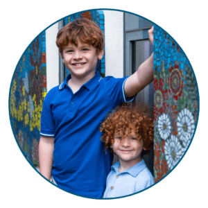 Two brothers aged approximatley 9 and 6, stoof next to the mosaic at Primrose Hospice