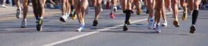 A group of people running in an organised running event.